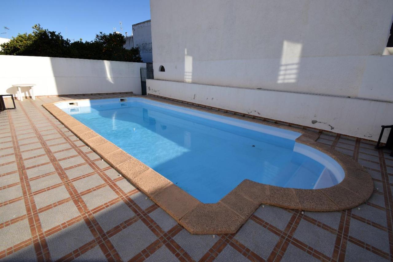 Piscina *